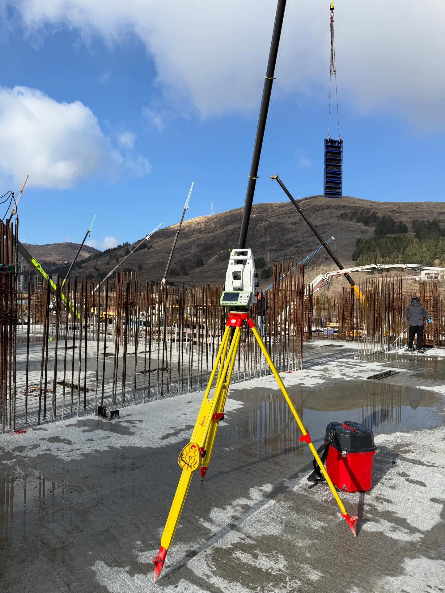 Leica surveying instrument controlling construction geometry on a building site in Armenia
